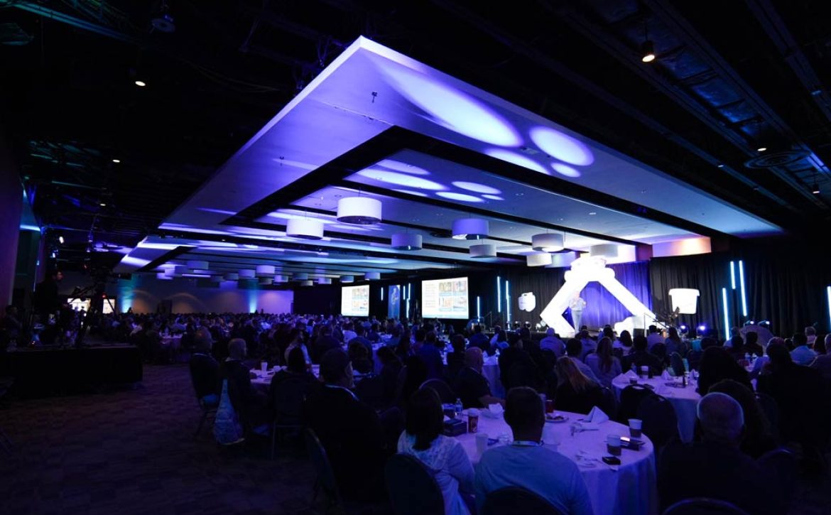 Conference delegates networking inside the MACC East Hall exhibit area