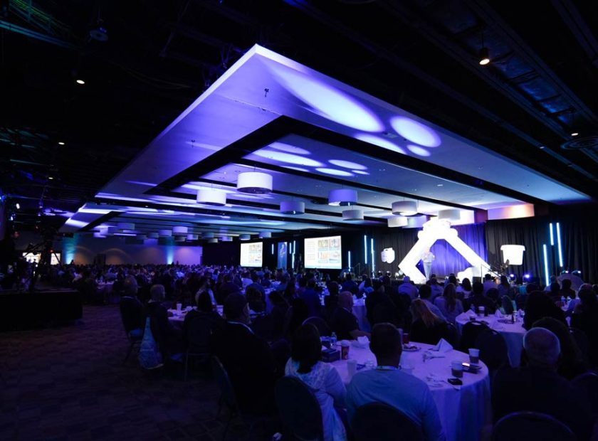 Conference delegates networking inside the MACC East Hall exhibit area