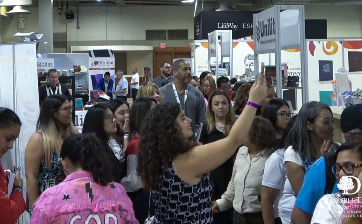 Attendees moving through the Miami Airport Convention Center (MACC) East Hall during a convention