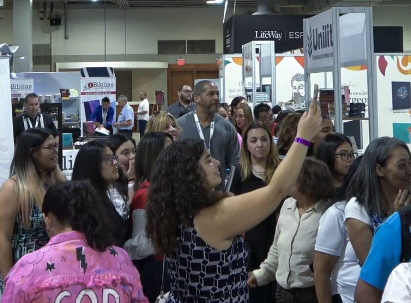 Attendees moving through the Miami Airport Convention Center (MACC) East Hall during a convention
